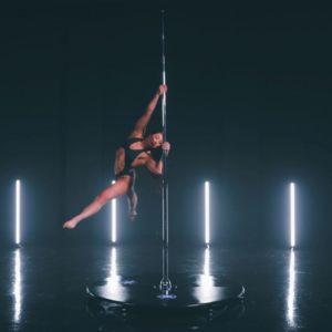 Luxury pole dance setup in modern pleasure playroom with ambient LED lighting in Charlotte NC