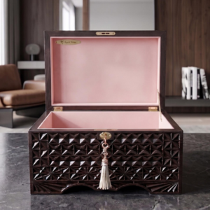 Luxury wooden storage chest with pink interior for discreet playroom accessory storage
